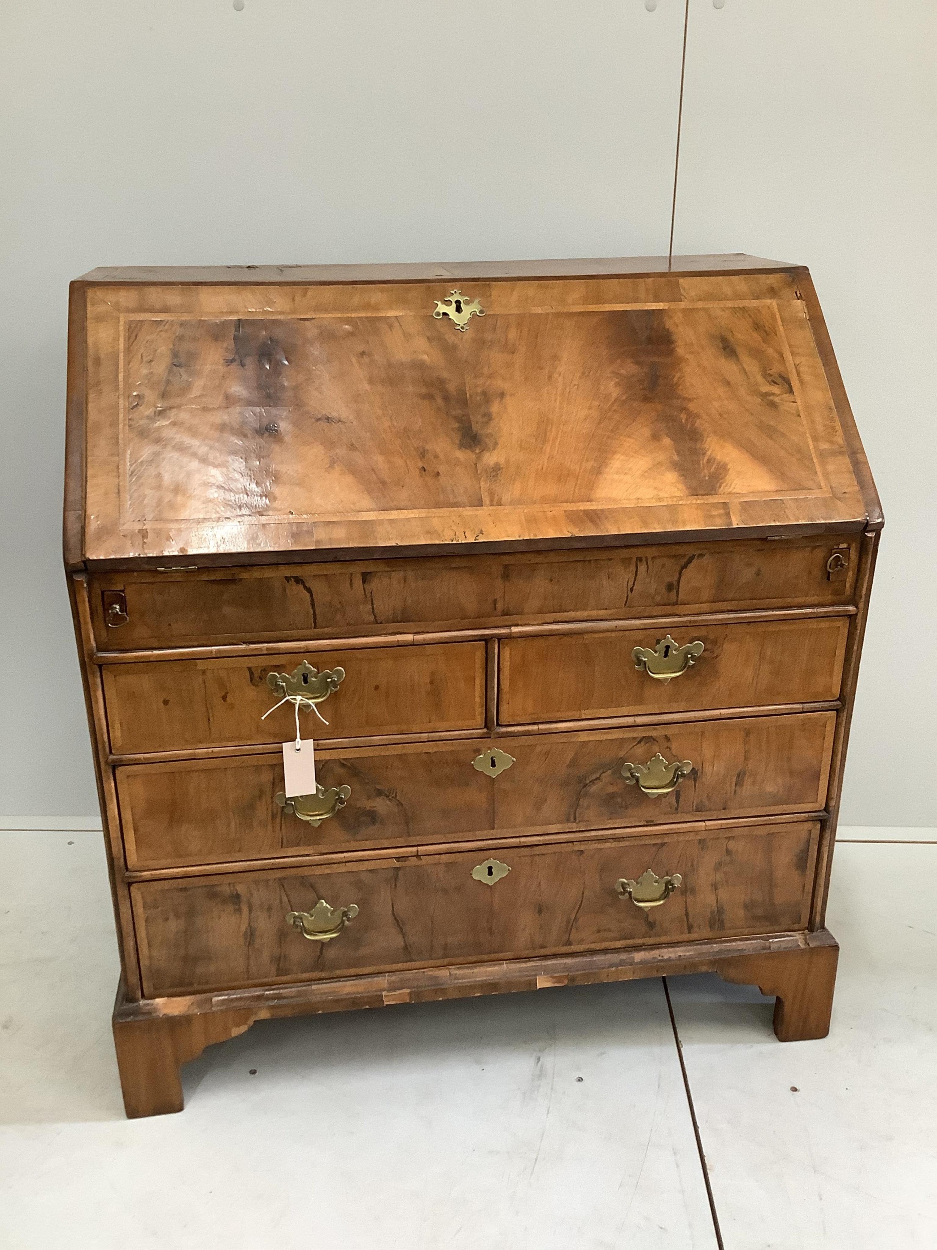 An 18th century feather banded walnut bureau, width 92cm, depth 50cm, height 100cm